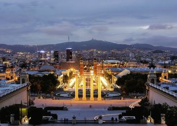 High angle view of illuminated buildings against cloudy sky. city of barcelona 