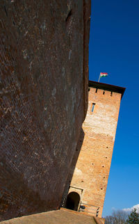 Low angle view of built structure against blue sky