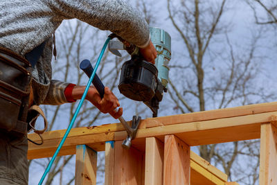 Low angle view of man working at construction site