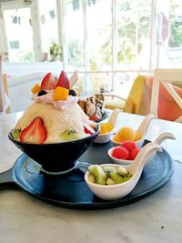 Close-up of fruits in bowl on table