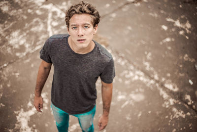 Portrait of young man standing at beach