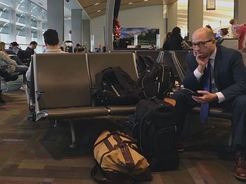 Men sitting at airport