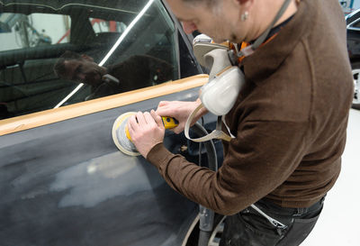 Engineer making car in workshop