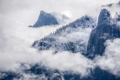 Clouds over rocky mountains