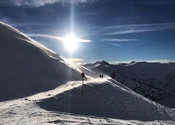 Scenic view of snowcapped mountains against sky