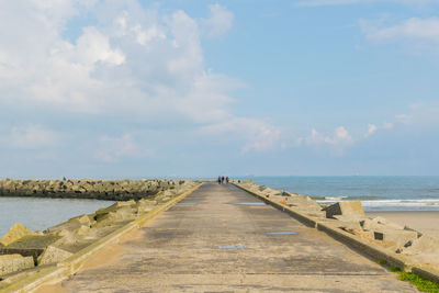 Pier over sea against sky