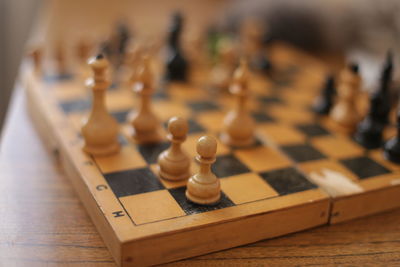 Close-up of chess pieces on table