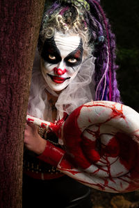 Portrait of woman with arms raised