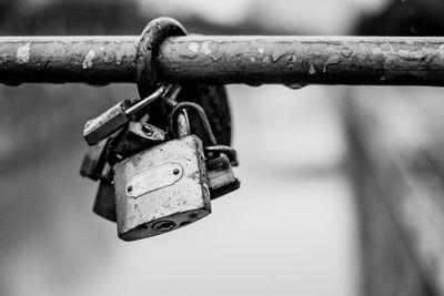 Close-up of padlocks on railing