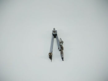 High angle view of telephone pole against white background