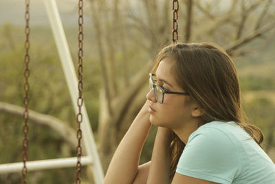 Portrait of girl looking through outdoors