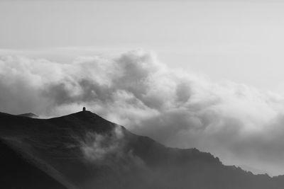 Scenic view of volcanic mountain against sky