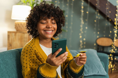 Young woman using mobile phone