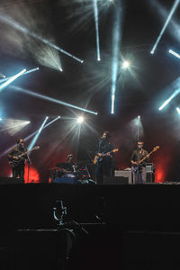 People enjoying concert at night