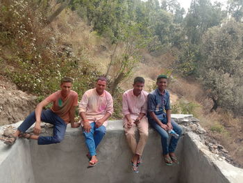 Group of people sitting outdoors