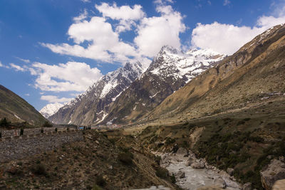 Scenic view of snowcapped mountains against sky