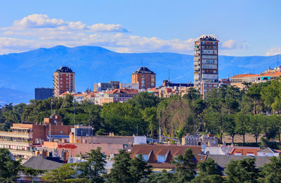 Buildings in city against sky