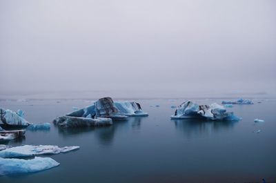 Scenic view of frozen sea against sky