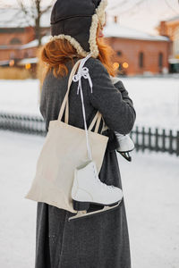 Rear view of woman wearing hat