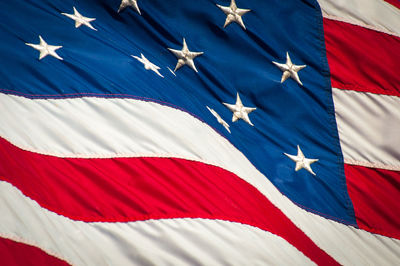 Close-up of flags against blue sky