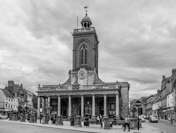 Low angle view of church against cloudy sky