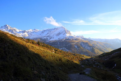 Scenic view of snowcapped mountains against sky