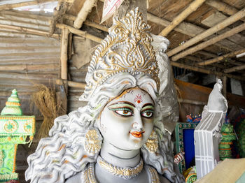 Head shot of goddess saraswati clay idol at a pottery in kolkata india.