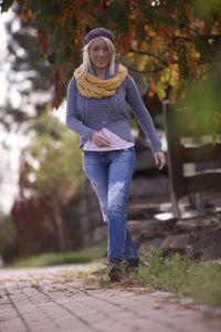 Portrait of a smiling young woman in autumn