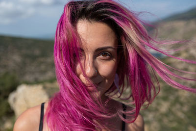 Portrait of beautiful woman with pink hair
