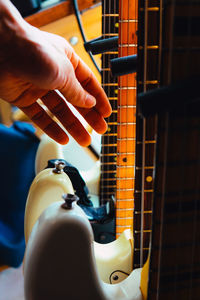 Close-up of hand holding guitar
