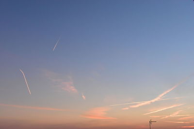 Low angle view of vapor trails in sky