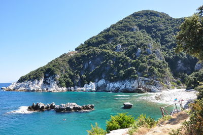 Scenic view of sea against clear blue sky