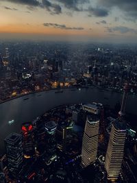 Aerial view of illuminated buildings in city