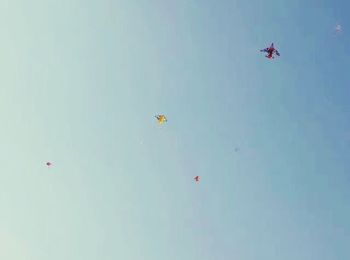 Low angle view of hot air balloons against sky