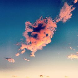 Low angle view of cloudy sky at sunset