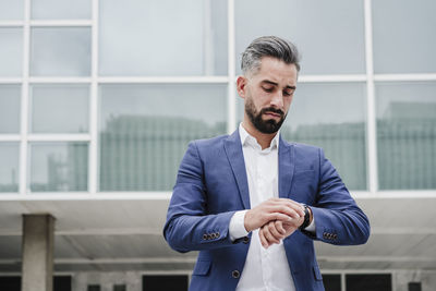 Mid adult man looking at camera