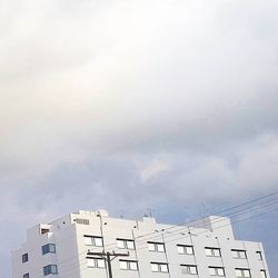 High section of building against cloudy sky