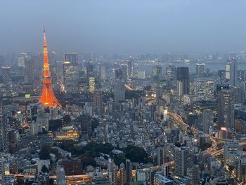 Aerial view of illuminated buildings in city