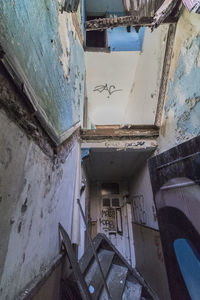 Low angle view of abandoned house