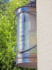 Close-up of metallic structure against wall