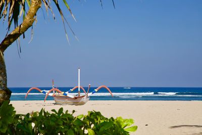 Scenic view of beach against clear sky