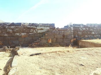 Old ruins against sky on sunny day