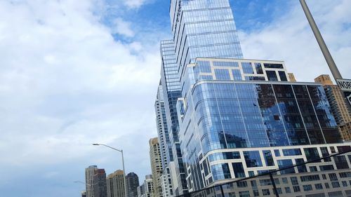 Low angle view of building against cloudy sky