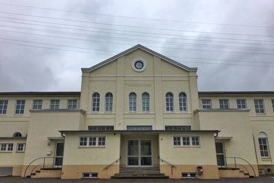 Building against cloudy sky