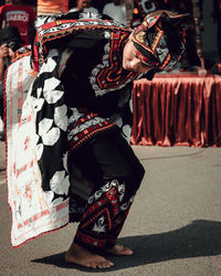 Side view of woman dancing on stage