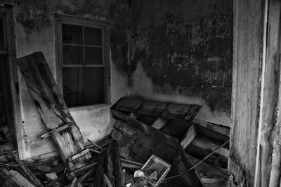 Damaged window of abandoned building