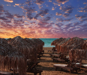 Panoramic view of beach against sky during sunset