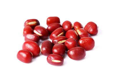 Close-up of tomatoes against white background