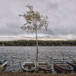 Scenic view of lake against cloudy sky