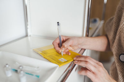 Doctor signing vaccination certificate at center